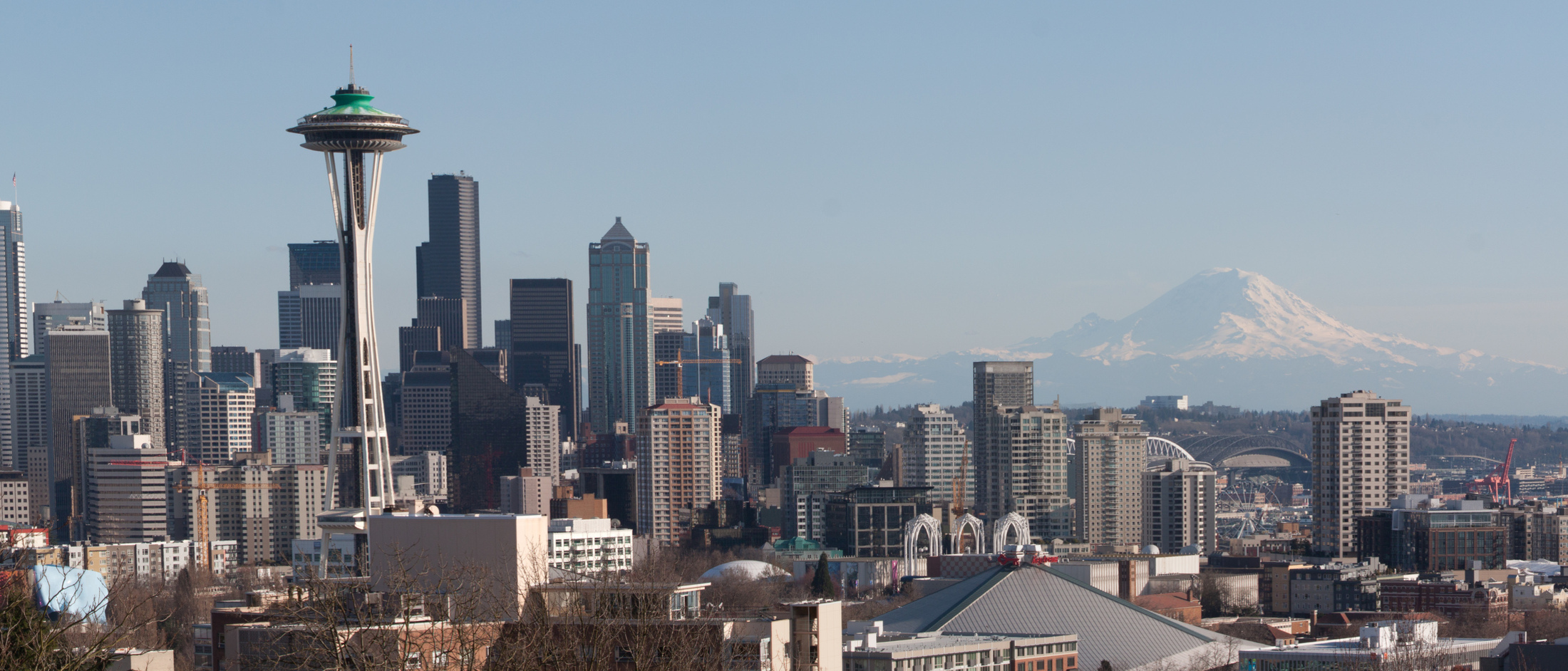 Downtown Seattle and the Space Needle over rooftops, with Mount Rainier on the horizon, seen from Kerry Park on Queen Anne